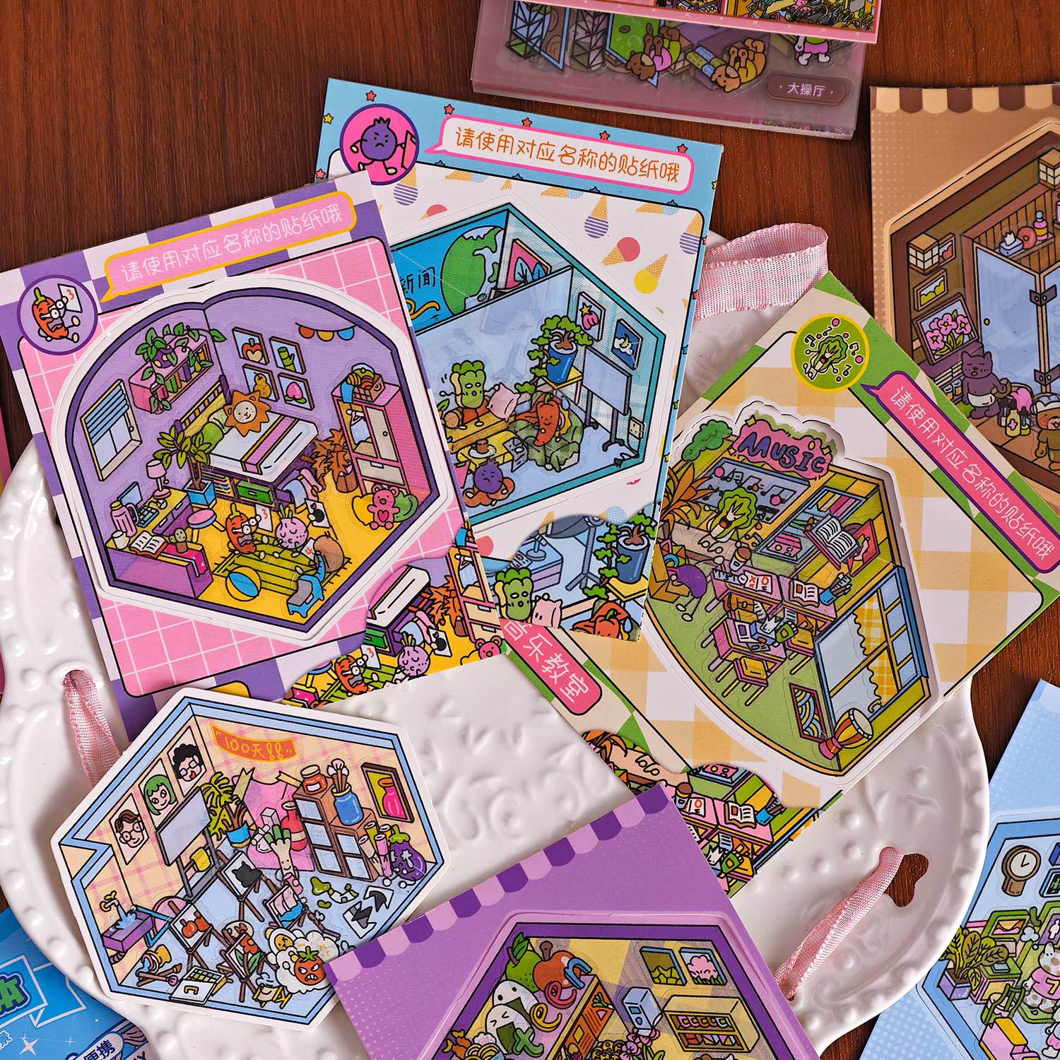 Spooky Cute Mini 3D Scene Stickers featuring colorful themed illustrations on sheets arranged on a decorative plate.